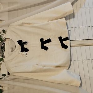 Chic White Jacket with Black Bow Accents